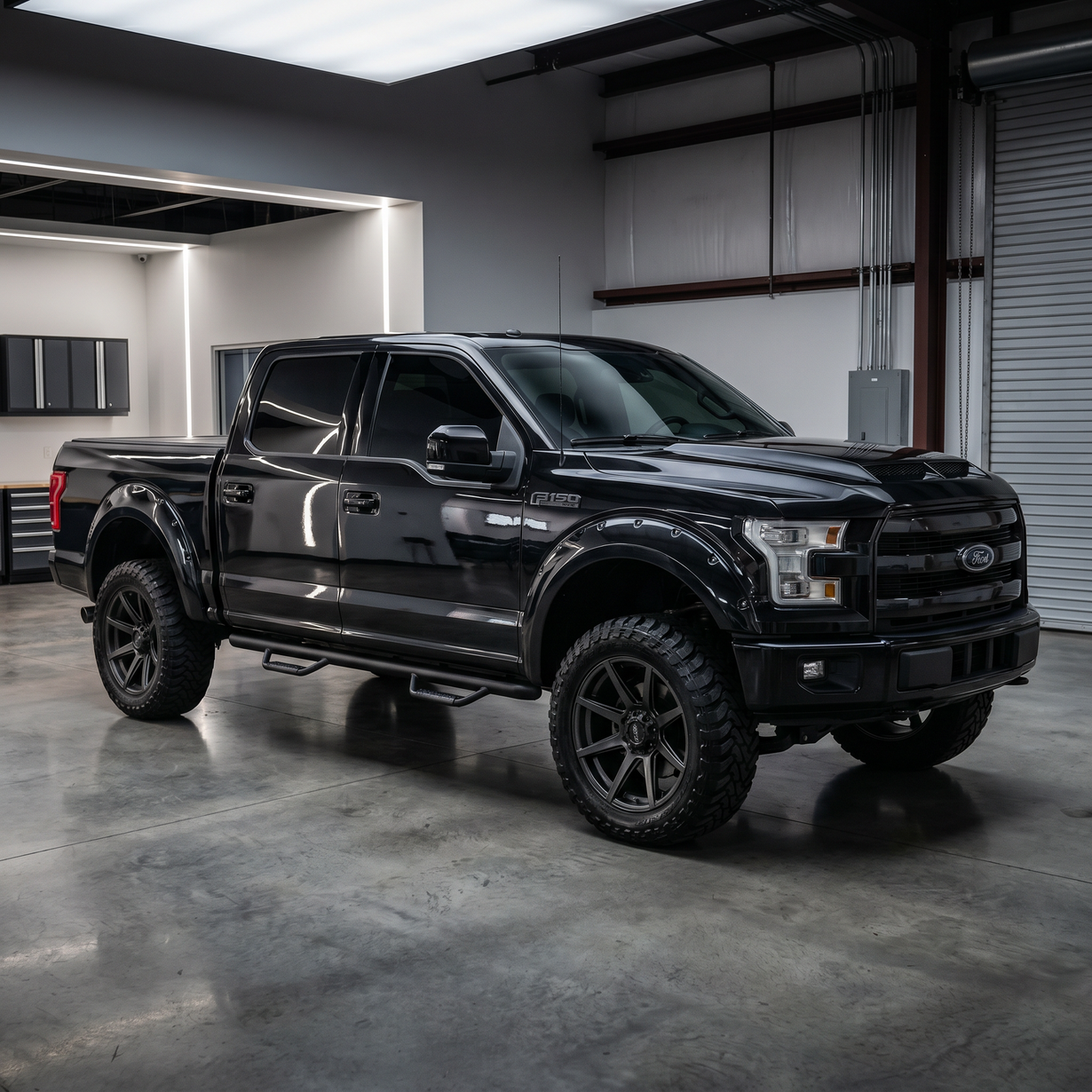 A black Ford F-Series crew cab dually pickup truck parked on a gravel surface.