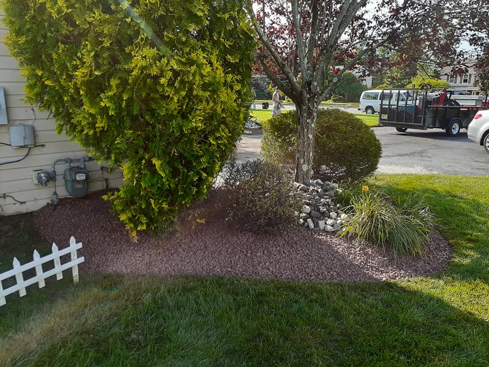A white pick up truck is parked in front of a house.