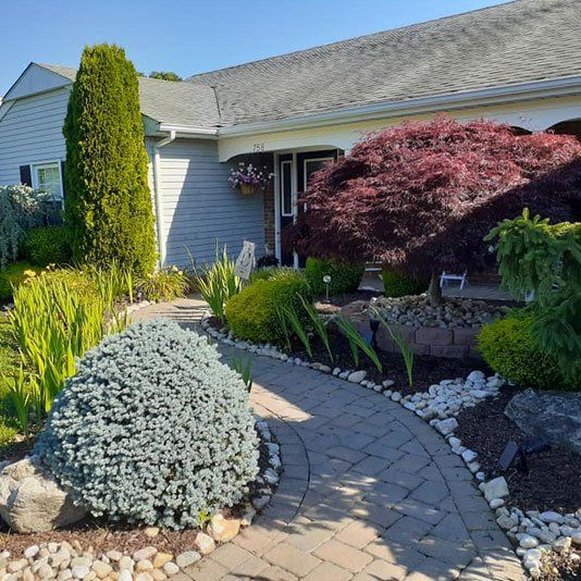 A house with a brick walkway leading to it