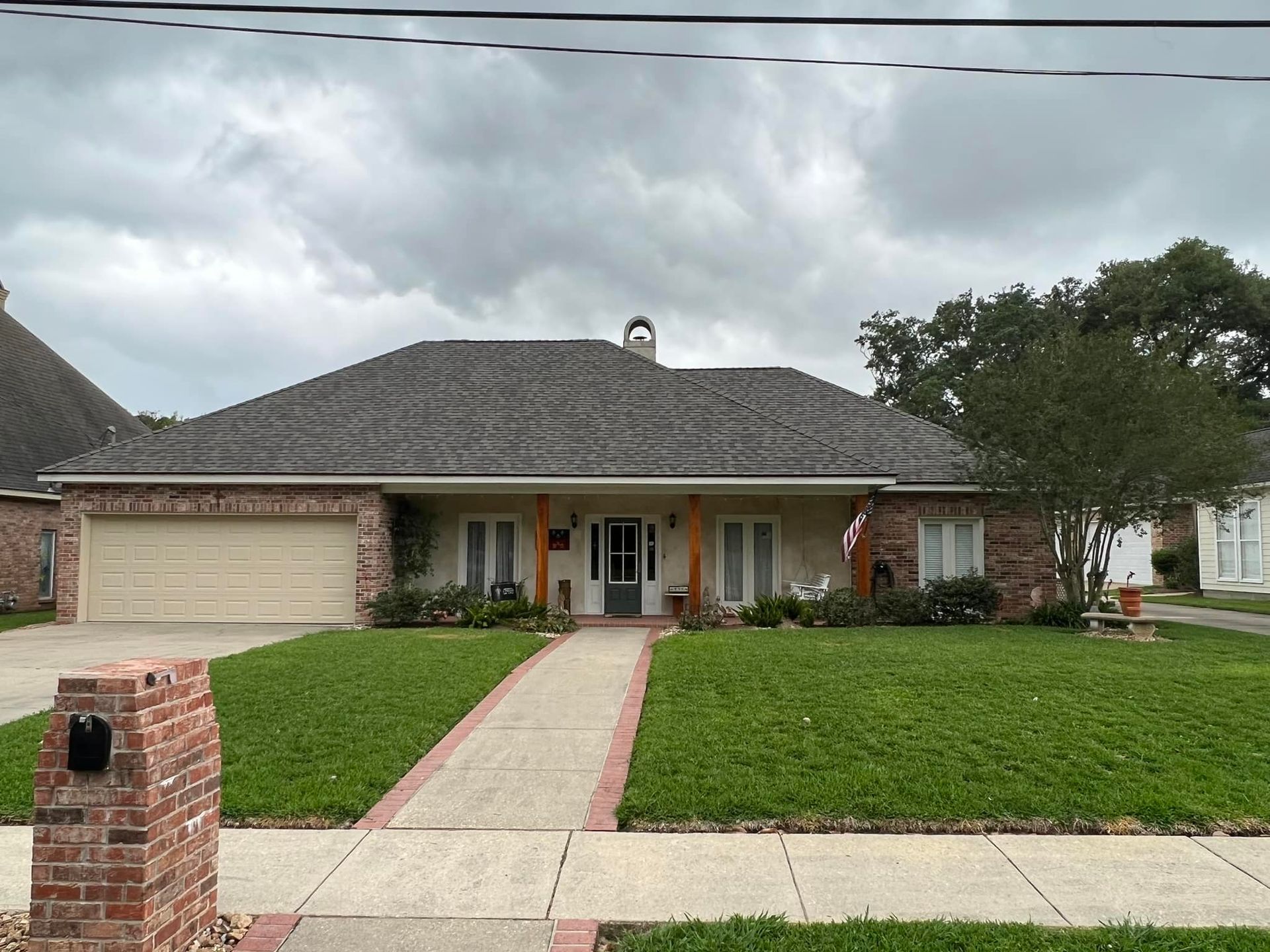 A house with a brick walkway leading to it
