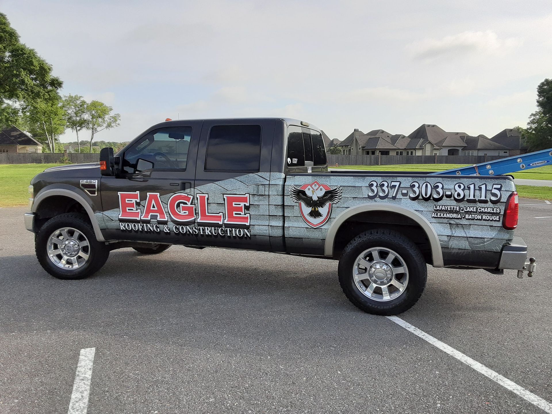 An eagle truck is parked in a parking lot.