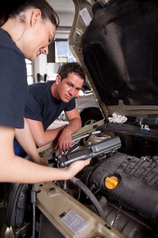 Technicians on car parts