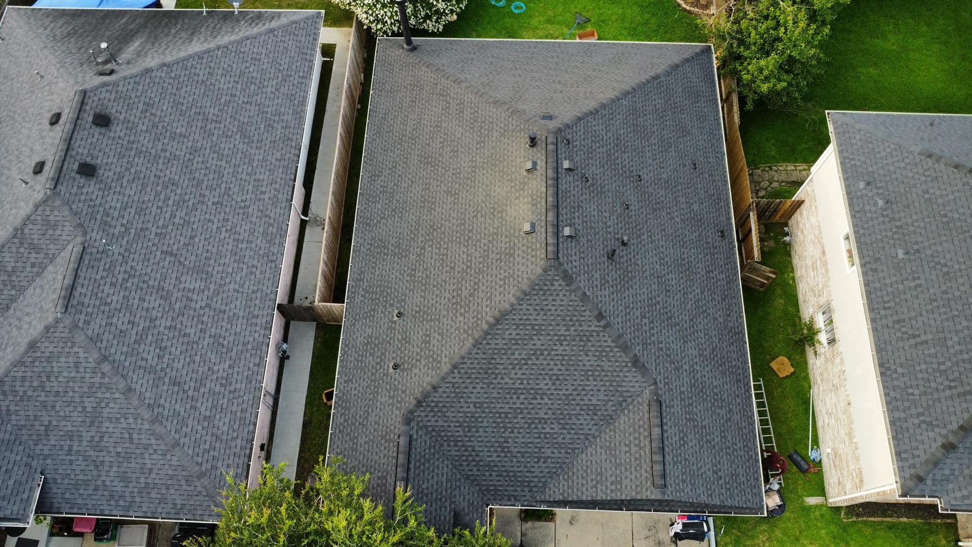 Aerial view of a gray asphalt shingle roof.