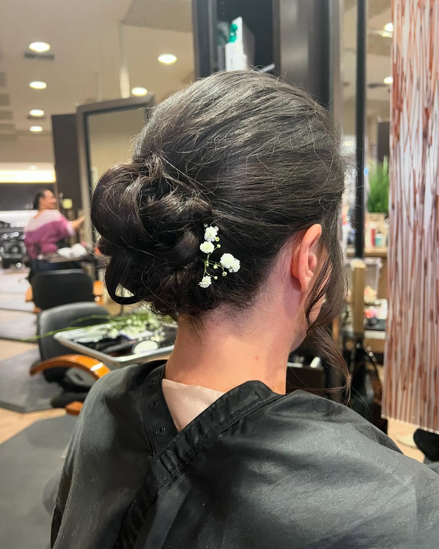 A woman is getting her hair done in a salon.