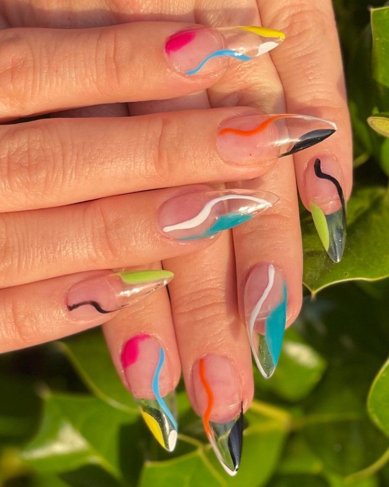 A close up of a person 's nails with a colorful design