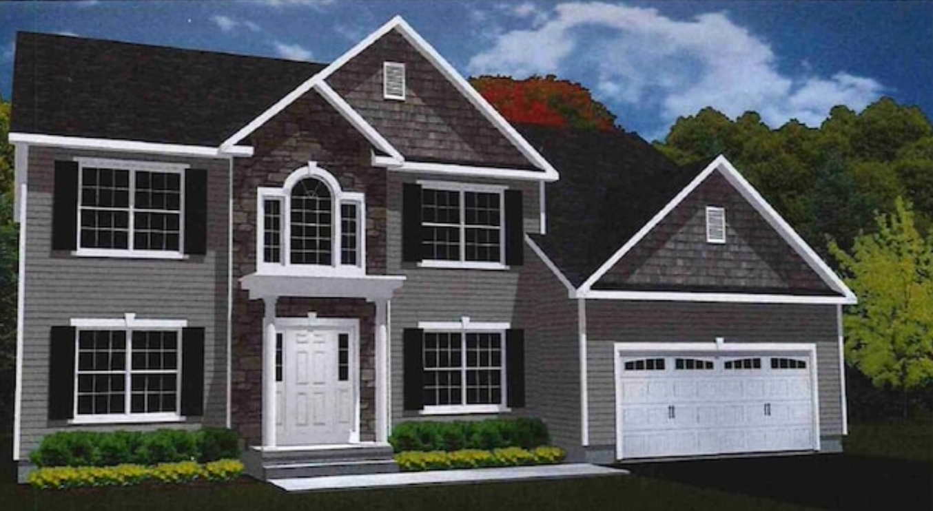 Two-story house with gray siding, brick facade, white trim, black shutters, and a two-car garage.