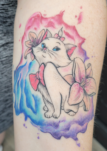 A woman has a tattoo of a dinosaur and flowers on her arm
