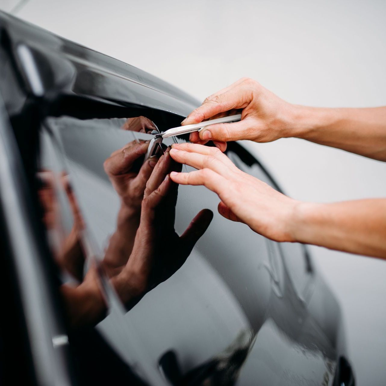 A close up of a window tinting service