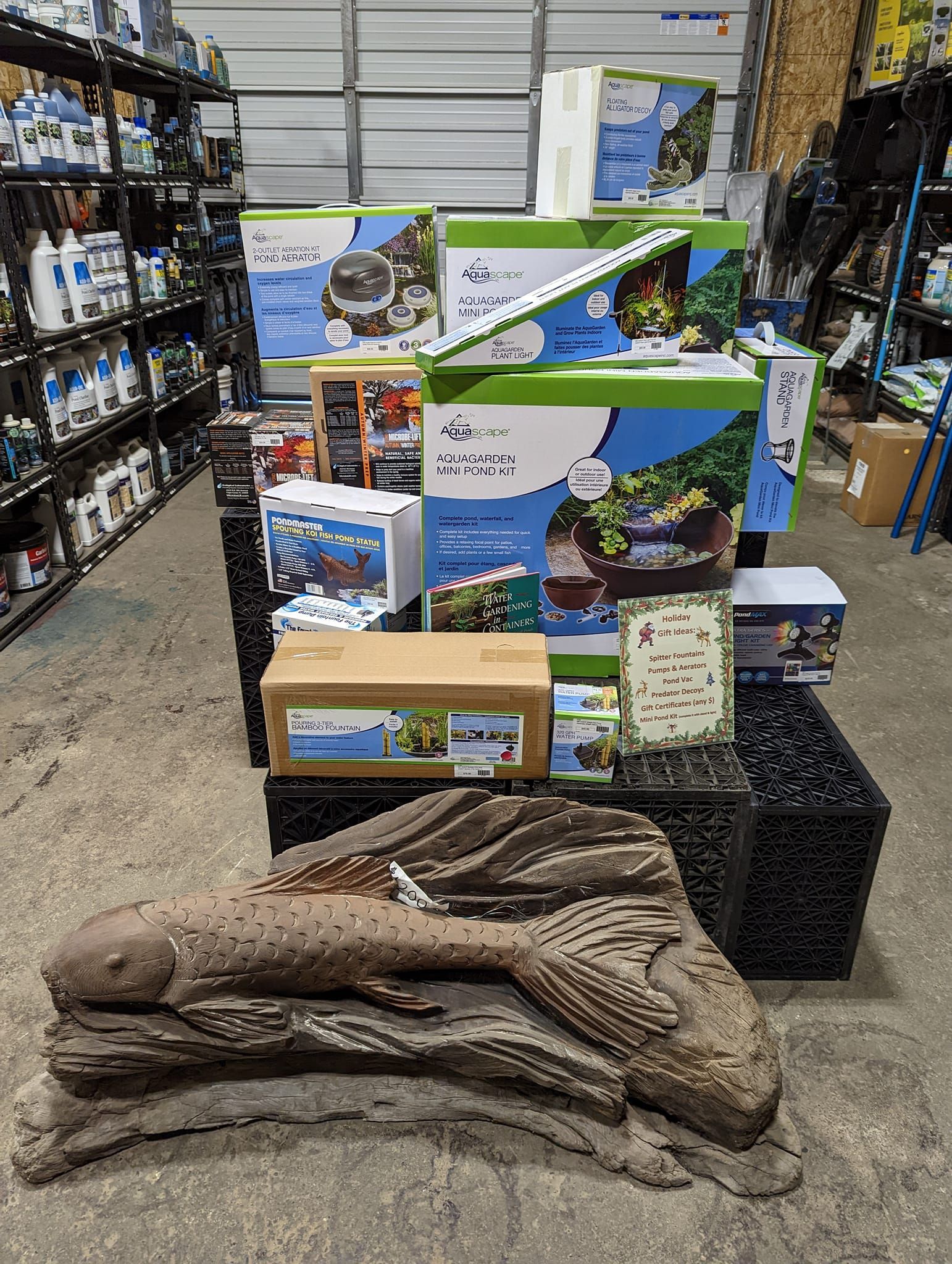 A warehouse filled with lots of boxes and a statue of a fish.