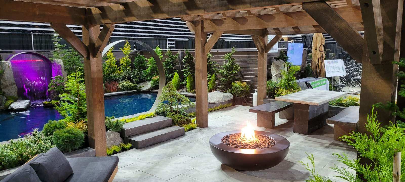 There is a fire pit in the middle of the patio.