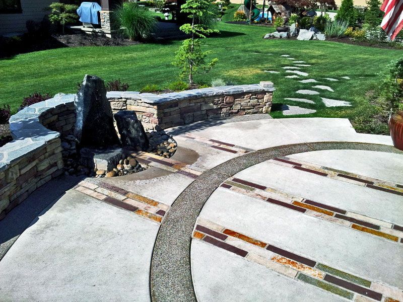 a patio with a fountain