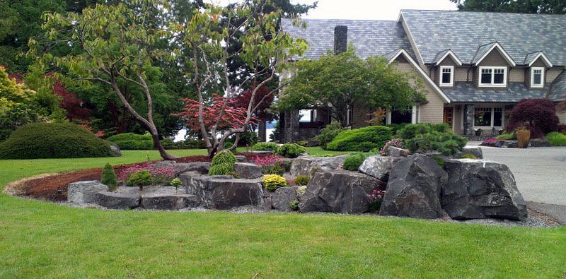 a large house with a lush green lawn
