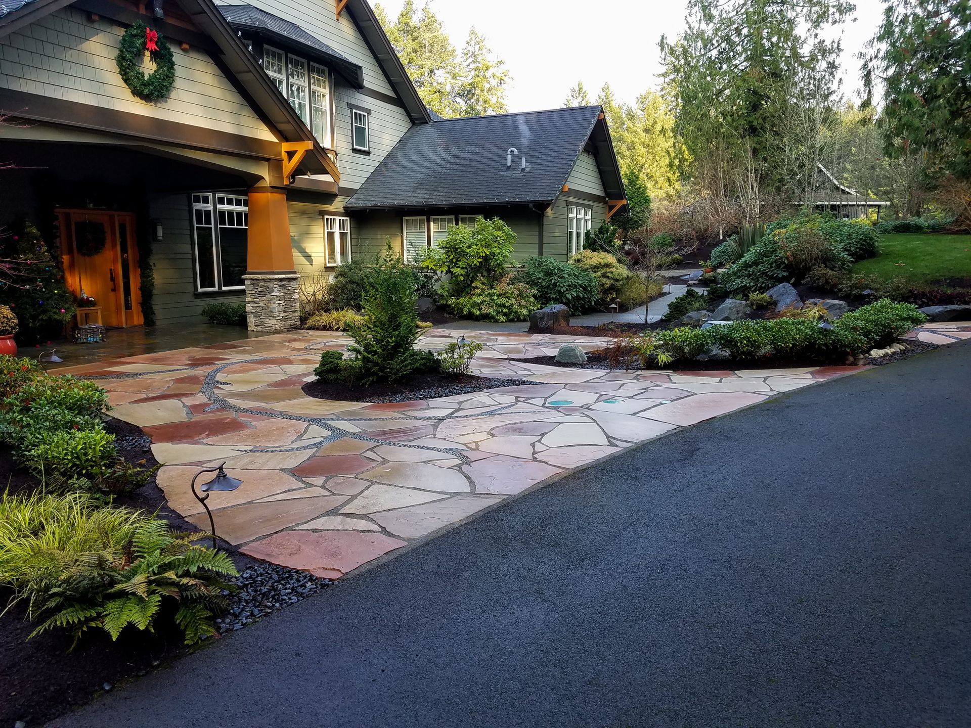 a large house with a wreath on the front door