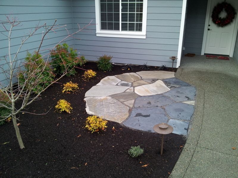 a house with a stone walkway in front of it