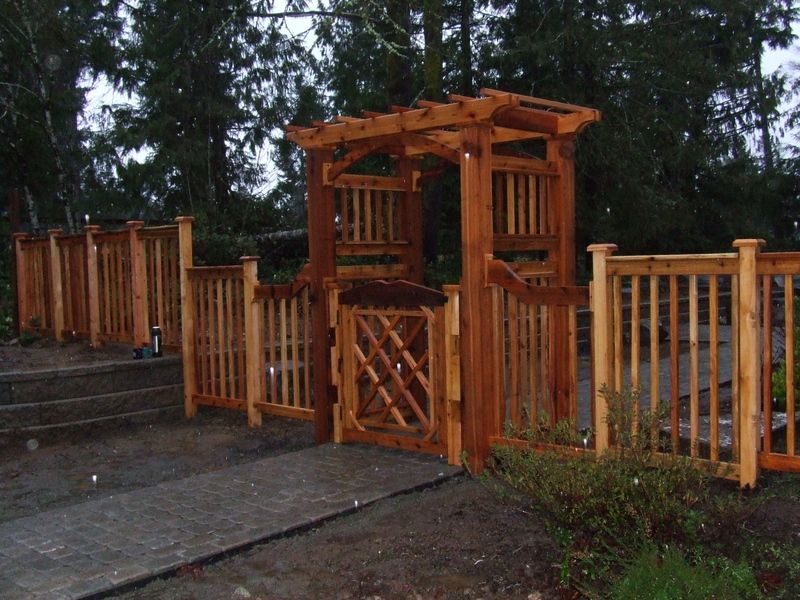 A wooden fence with a gate in the middle