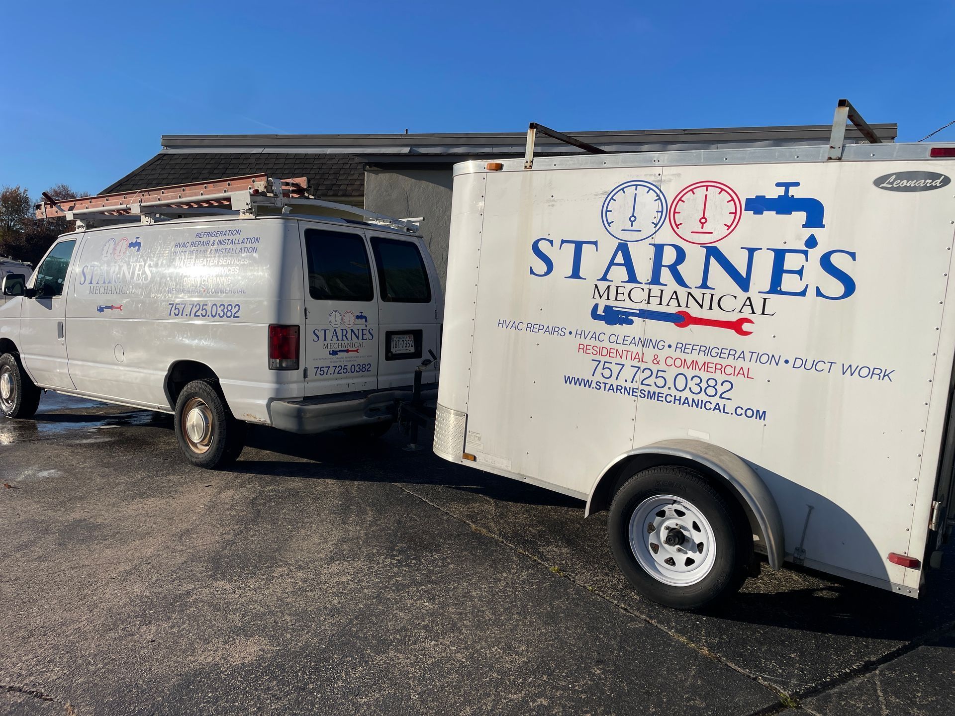 White van and trailer for Starne's Mechanical parked outdoors on a sunny day.