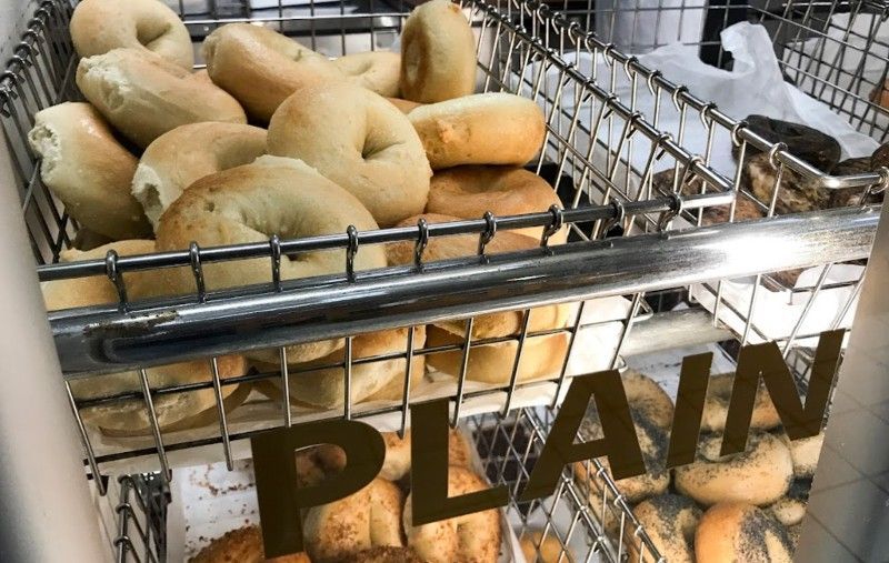 A basket of bagels with the word plain on it