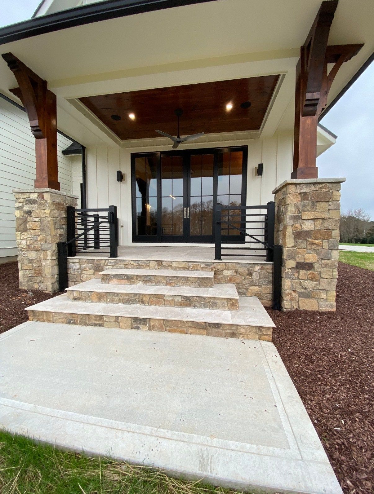The front of a house with stairs leading up to it