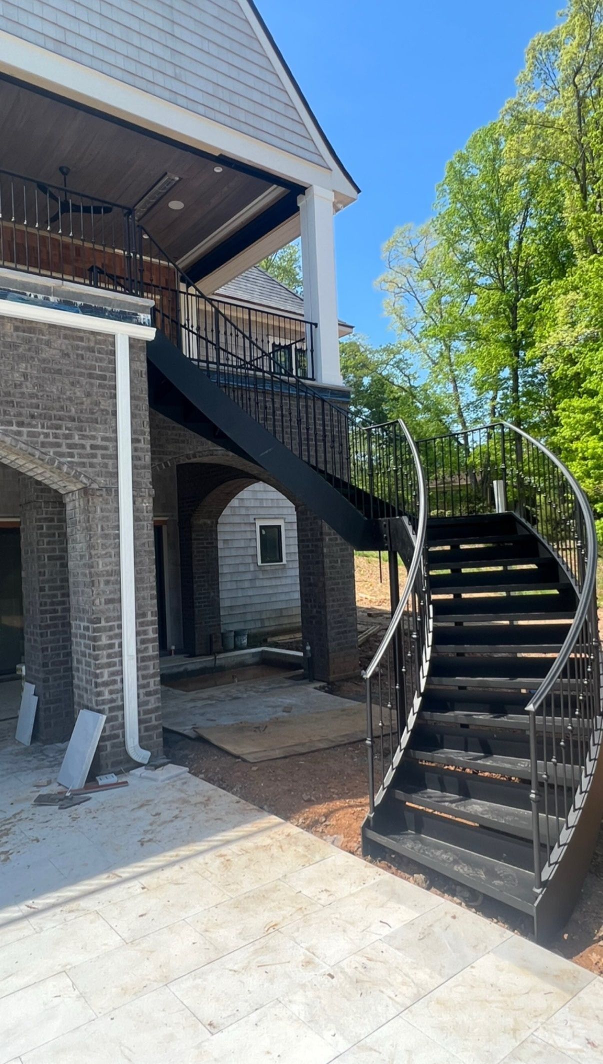 A house with a spiral staircase leading up to the second floor.