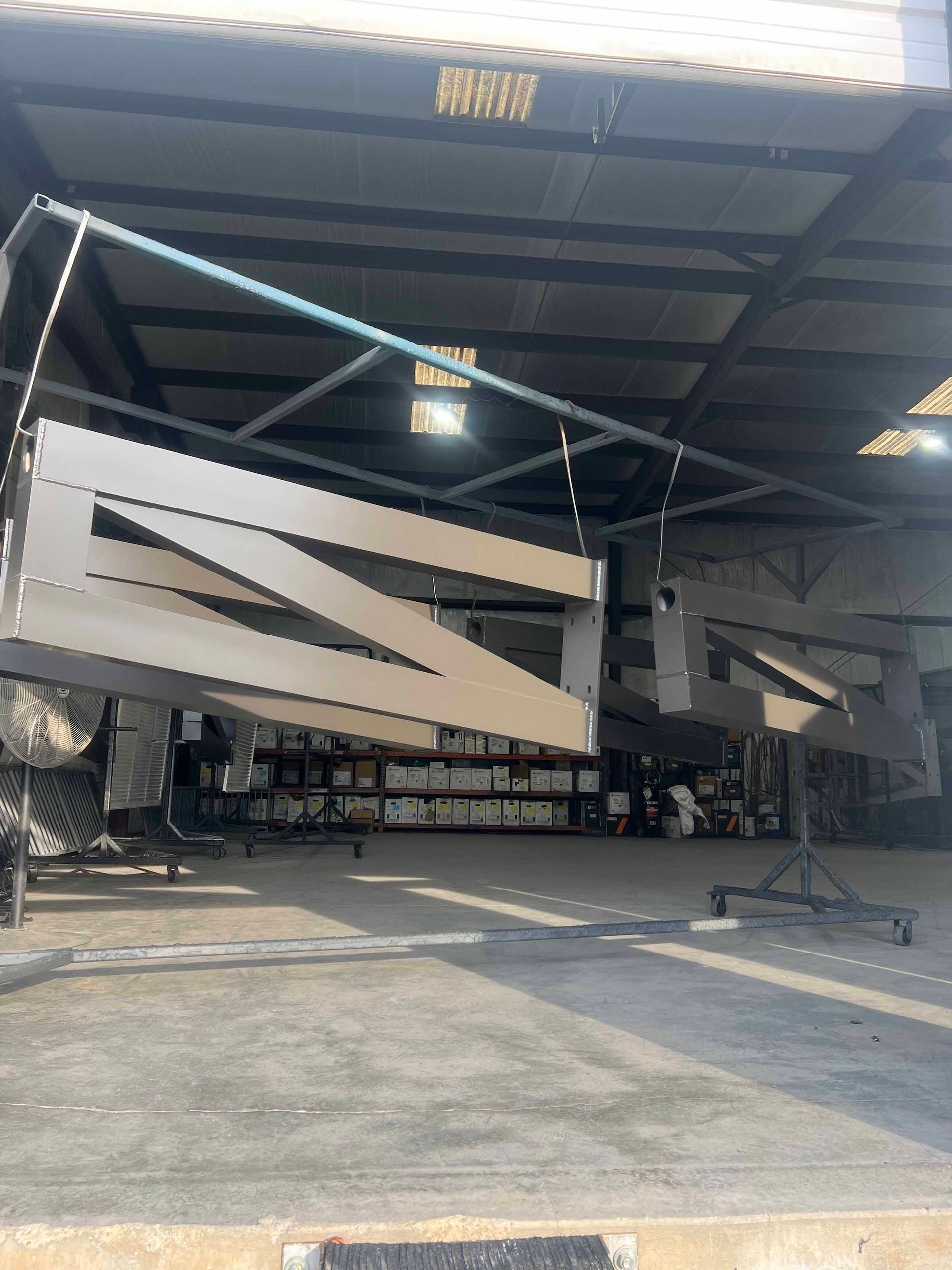 A large metal structure is sitting inside of a building.