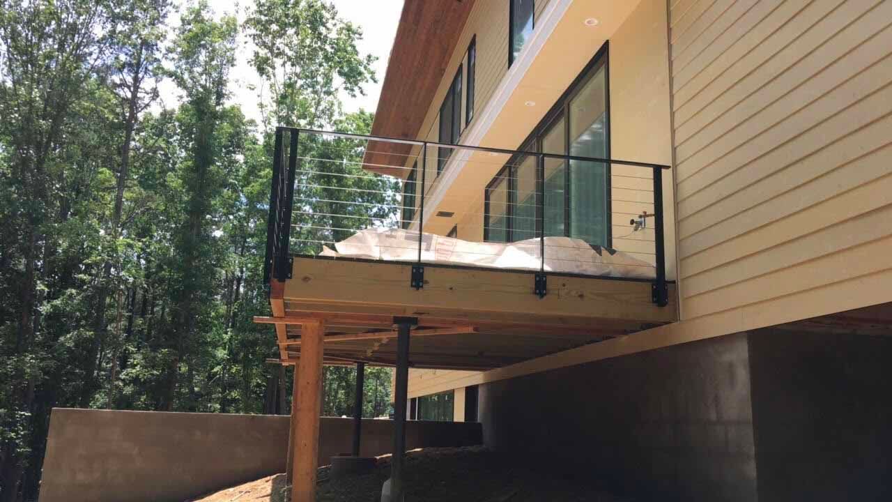 A large house with a balcony on the side of it