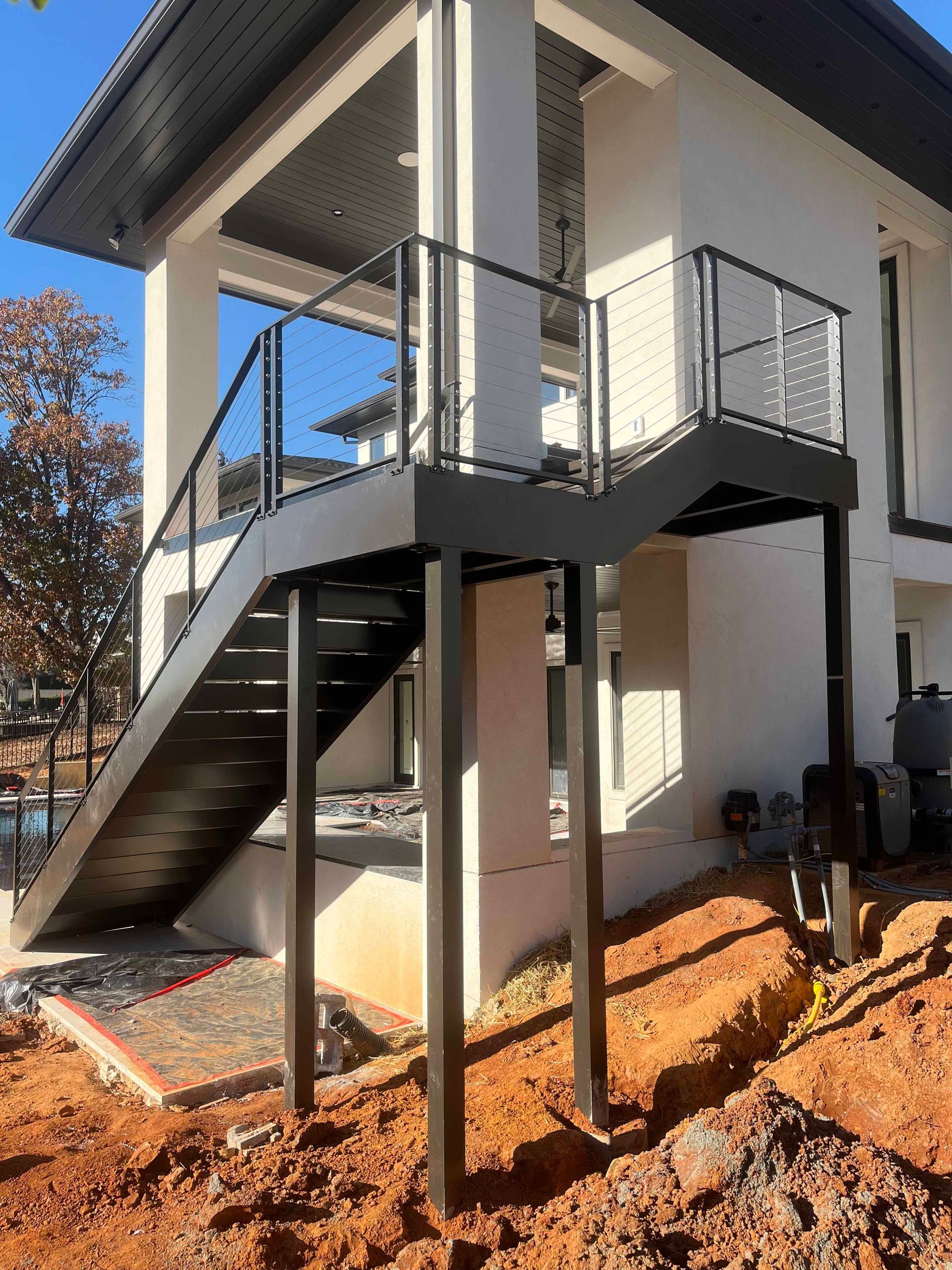 A staircase is being built on the side of a house.