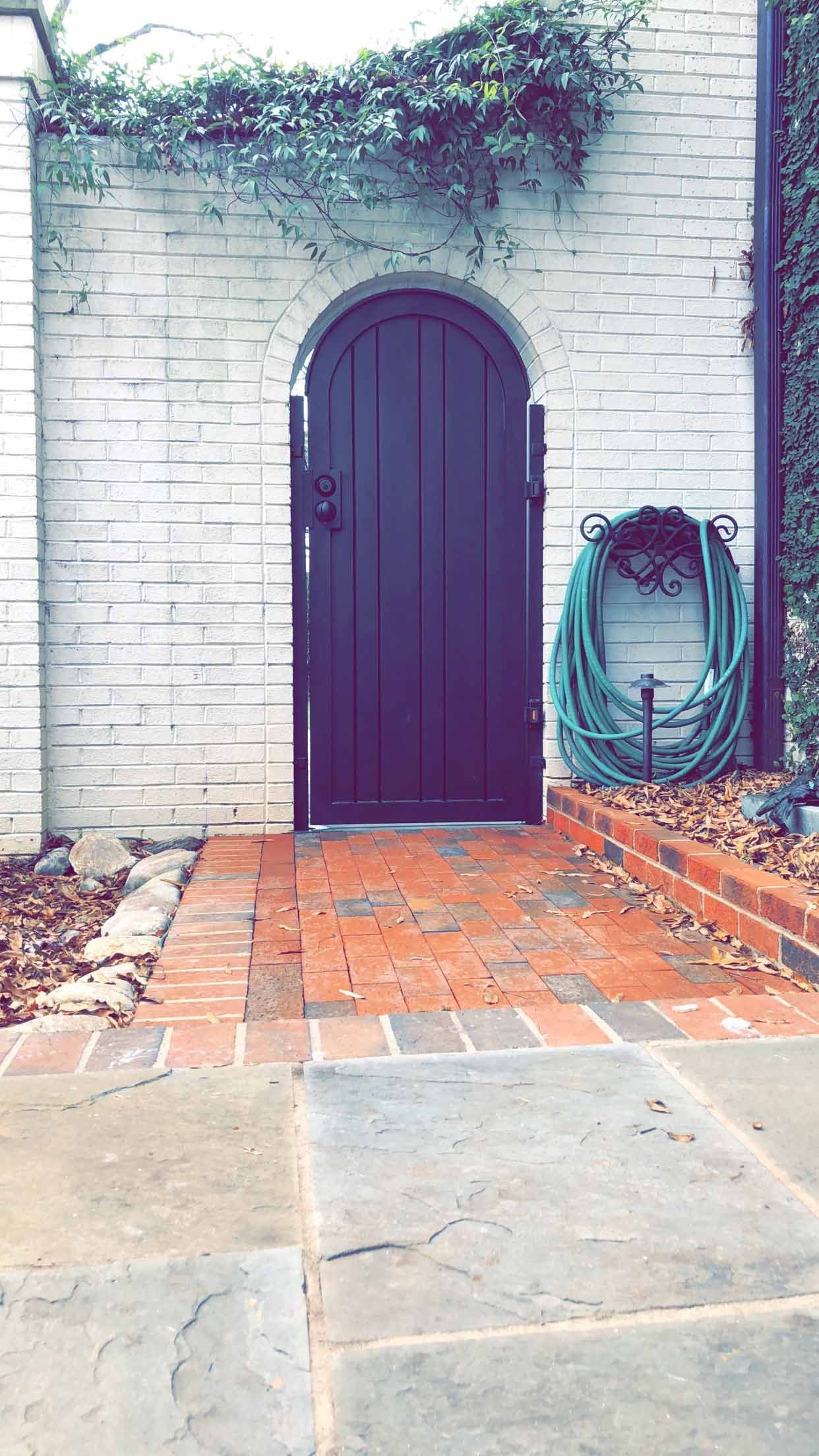 There is a hose hanging on the side of the door.