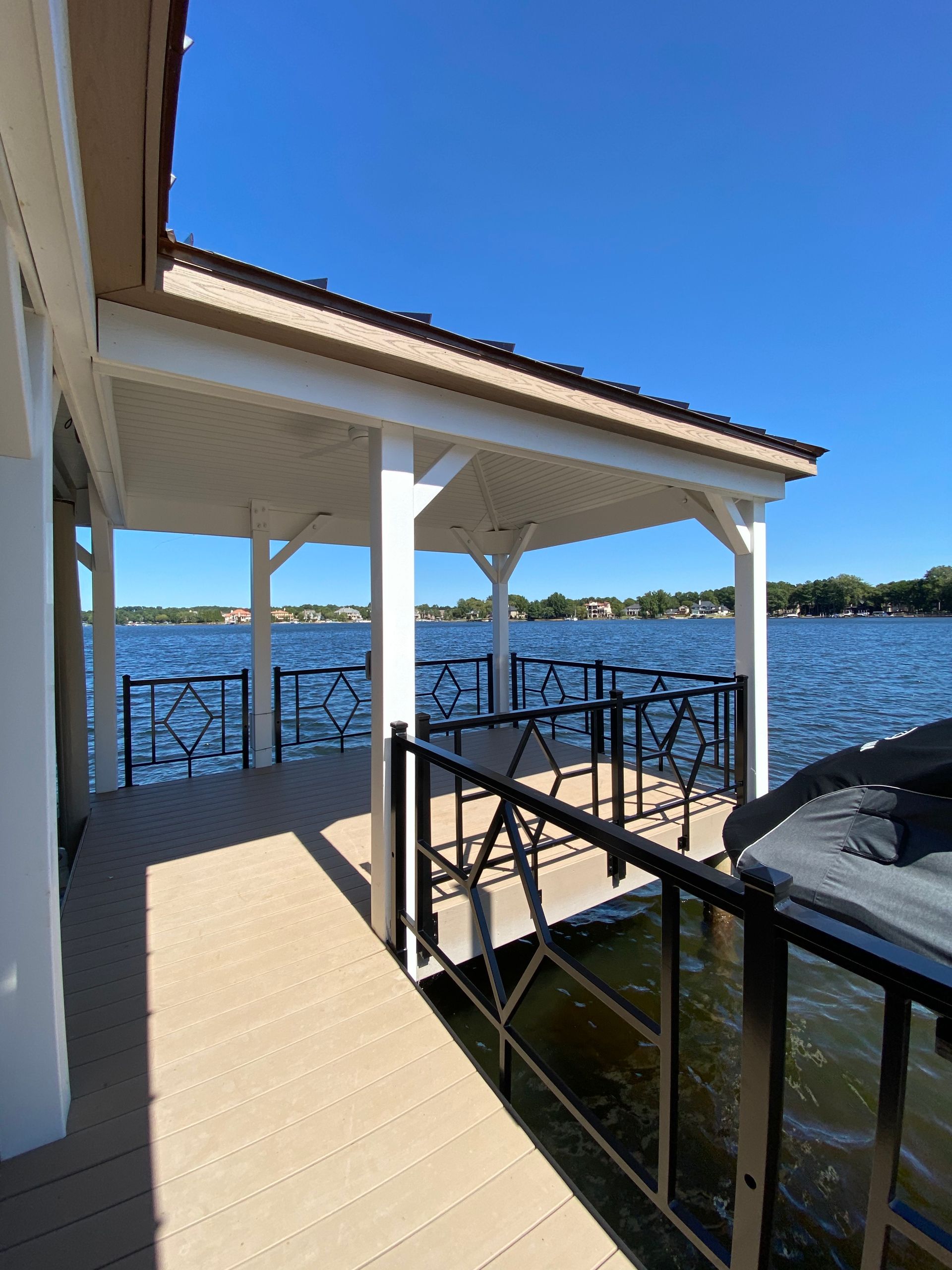 A covered dock overlooking a large body of water