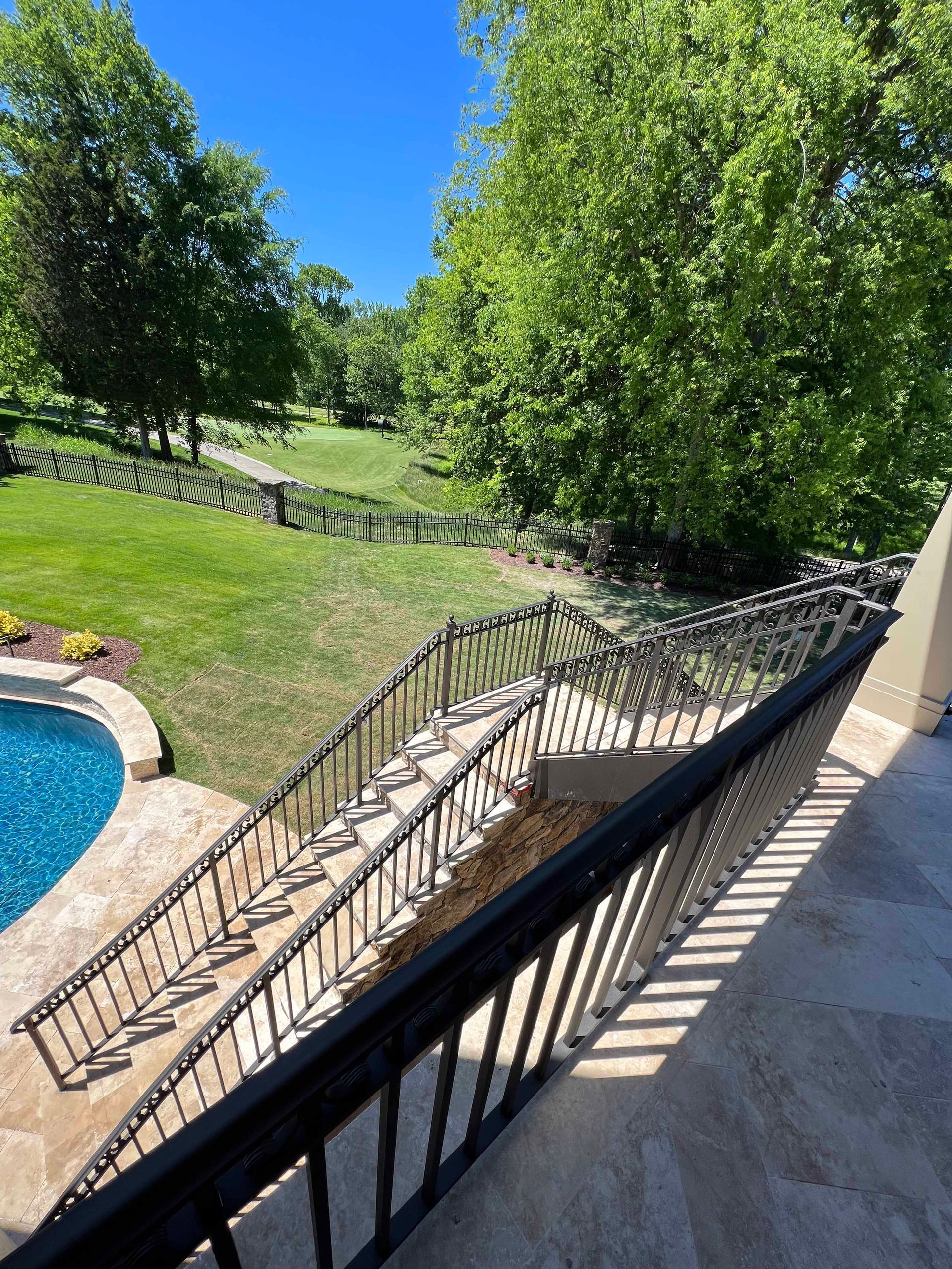 A view of a swimming pool from a balcony