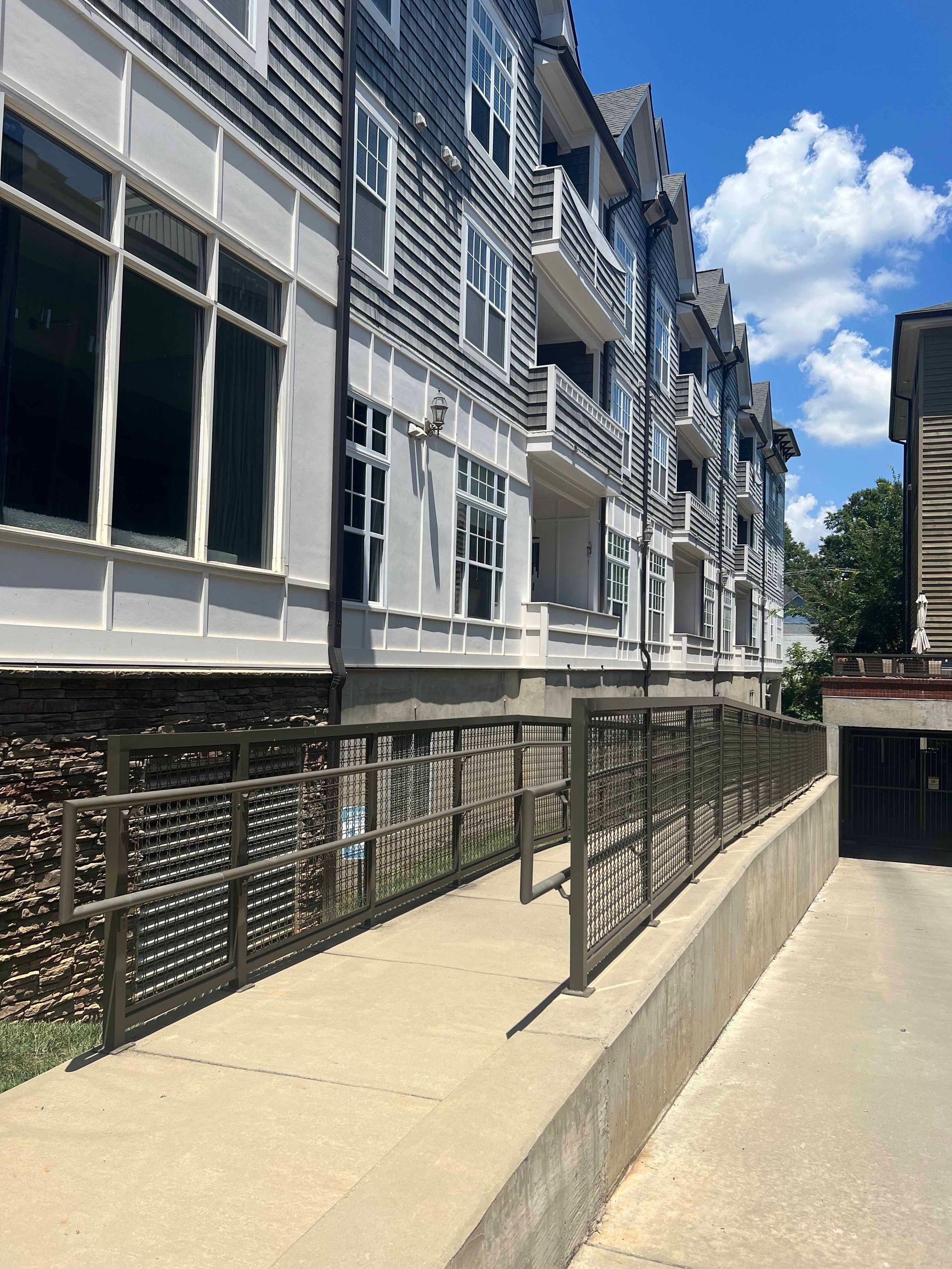 A building with a ramp that leads to a garage