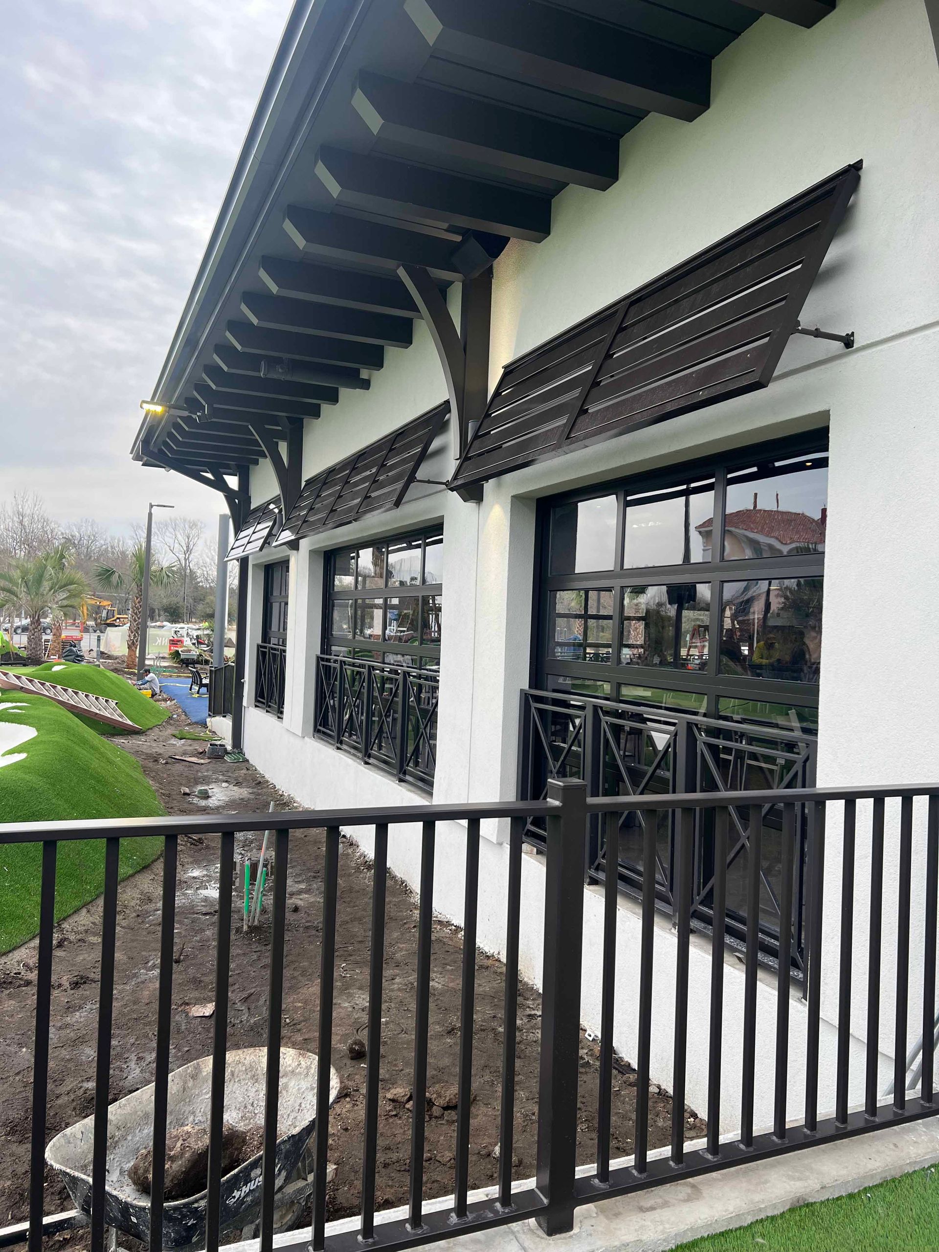 A building with a fence around it and a lot of windows.