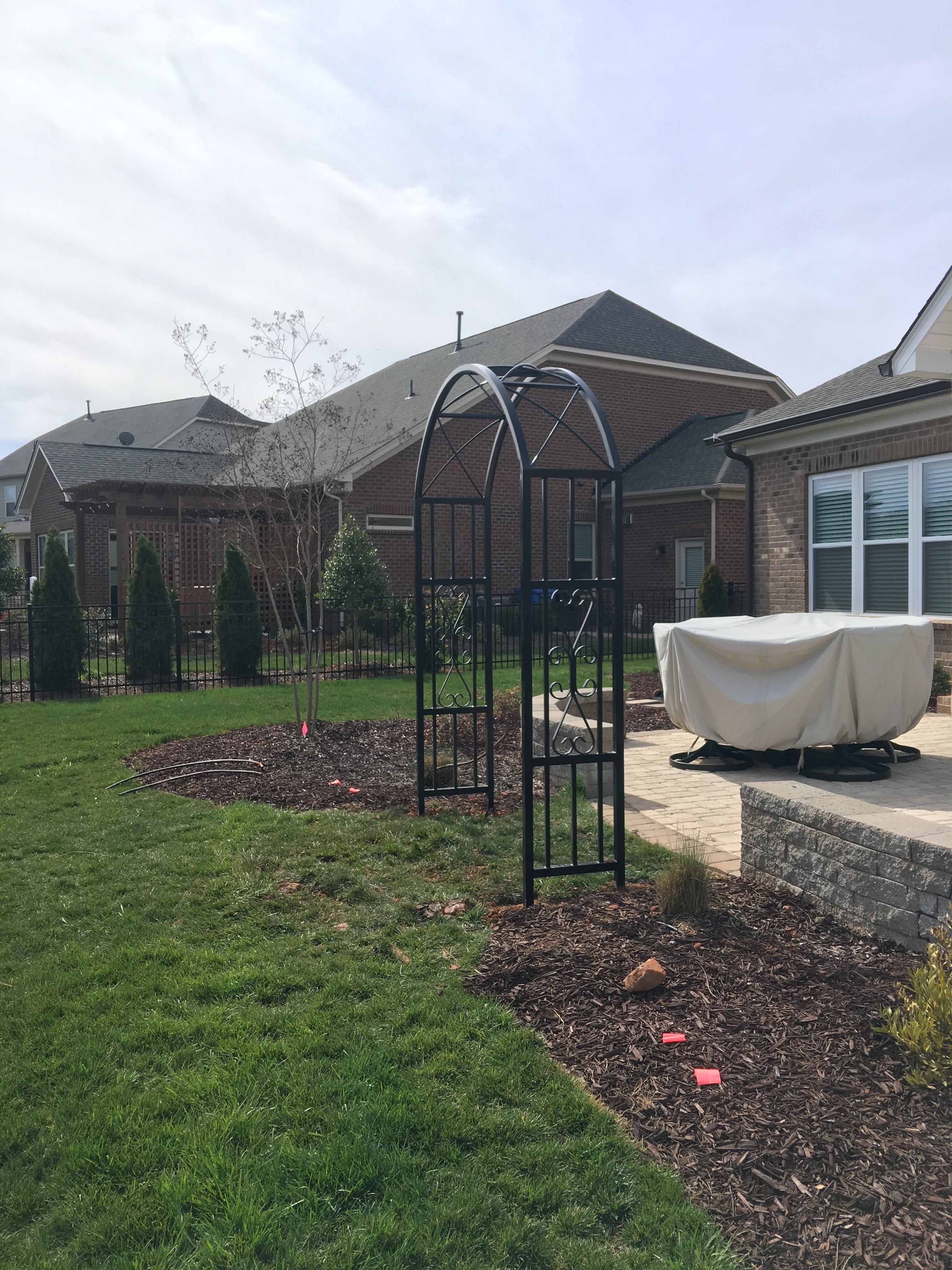There is a hot tub in the backyard of a house.