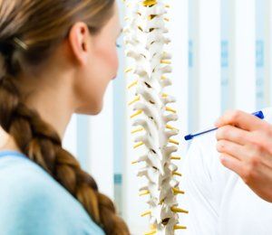 Discussing spine problem with patient