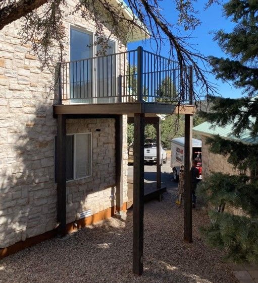 A house with a balcony on the side of it