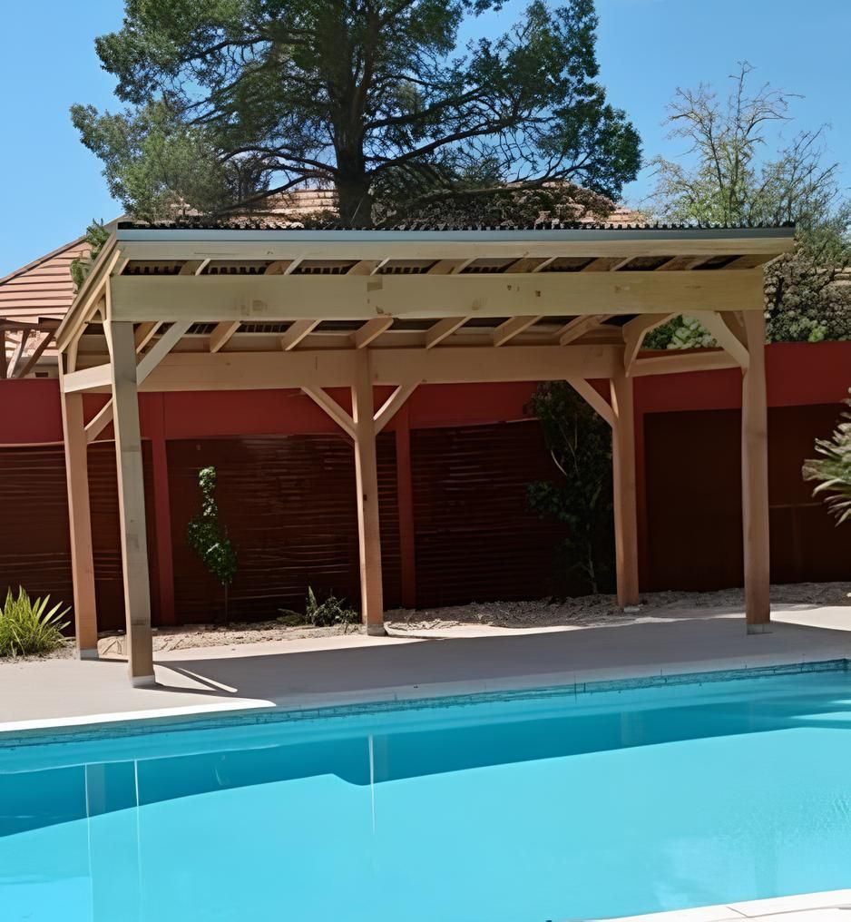 A large swimming pool with a wooden pergola over it