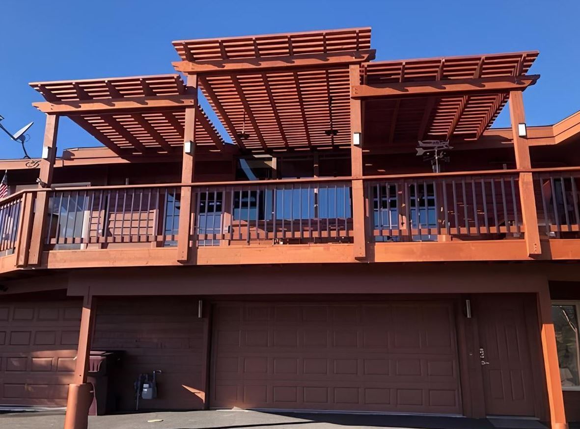 A house with a pergola on top of it