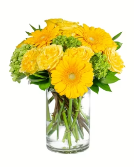 a vase filled with yellow flowers and greenery