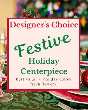 Designer's Choice Festive Holiday Centerpiece ad. Sign on a table with fresh flowers and holiday colors.