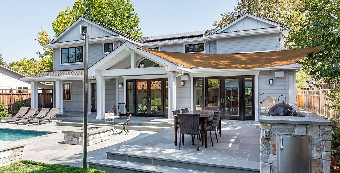A beautiful patio with chairs and a table