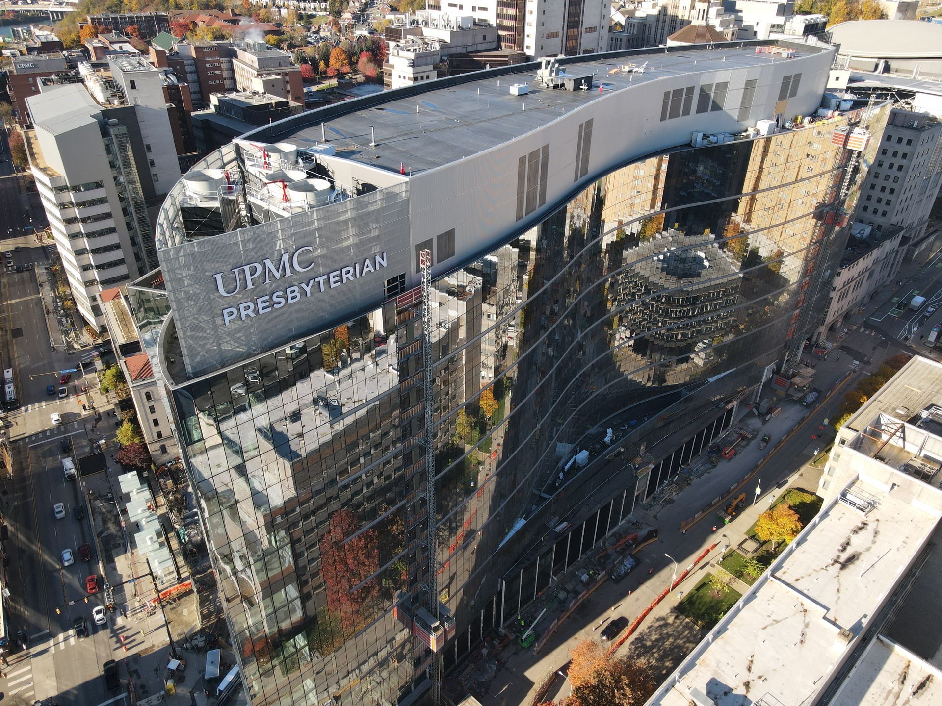 UPMC Presbyterian Hospital, Pittsburgh, PA. Mirrored glass exterior reflecting surrounding buildings and sky.
