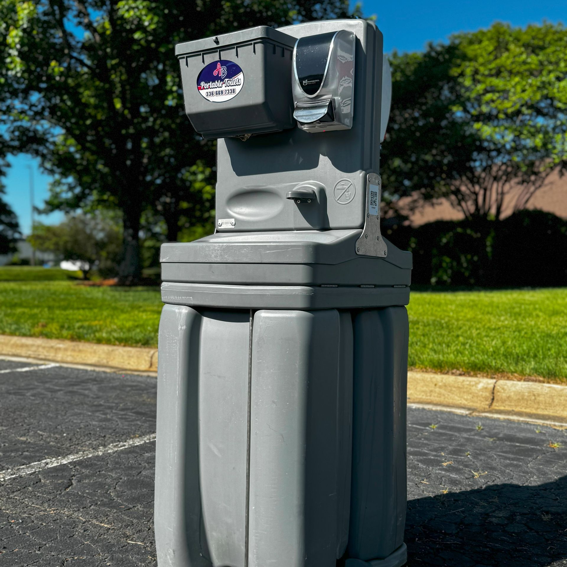 A row of stadium seats with a hand sanitizer dispenser