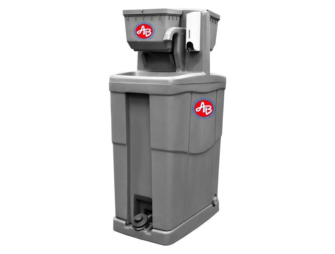 A portable sink with a hand sanitizer dispenser attached to it.