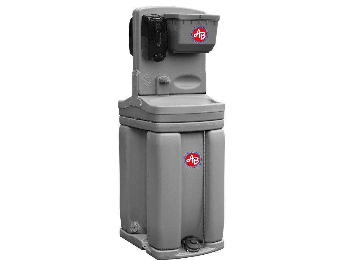 A portable sink with a soap dispenser attached to it.