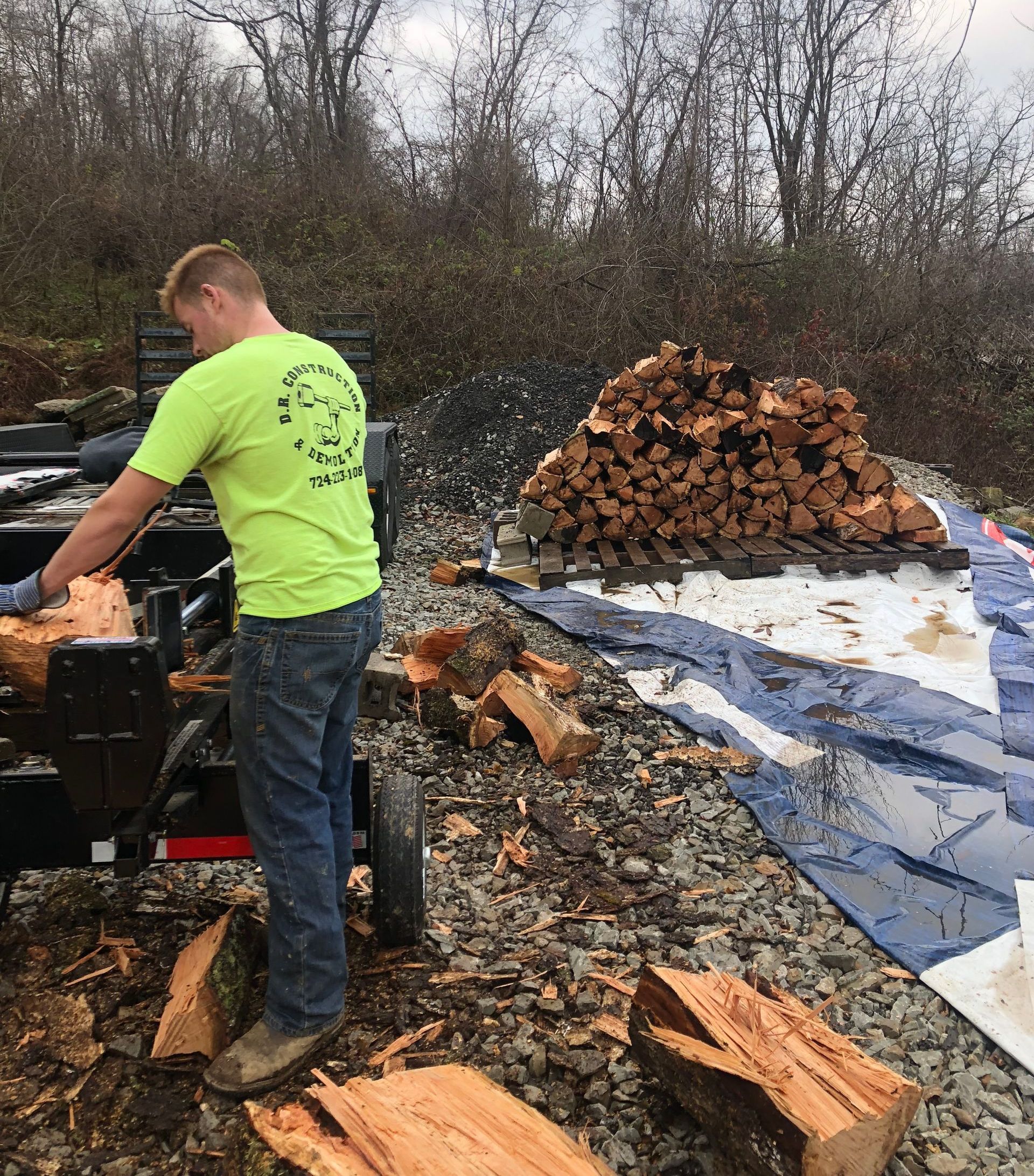 Clearing land by truck and backhoe