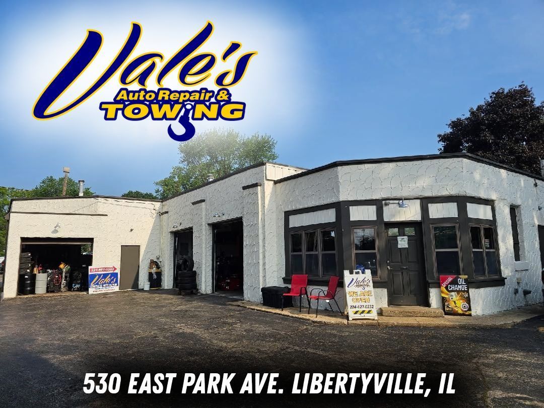 Vale's Auto Repair & Towing building at 530 East Park Ave. Libertyville, IL. White building with open garage bays, sunny day.