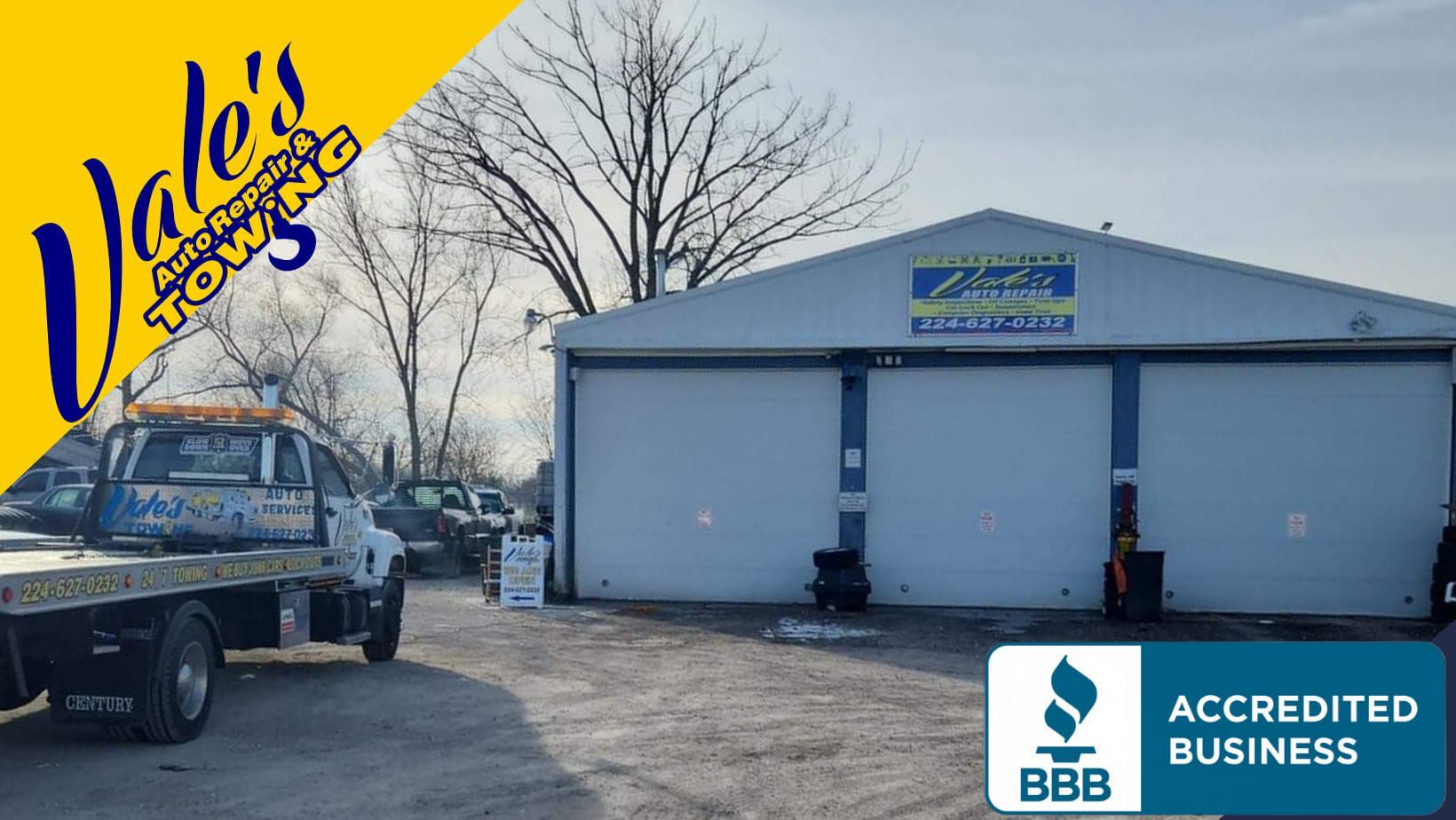 Vale's Automotive & Towing: Tow truck in front of a blue garage with the company logo. Accredited BBB.