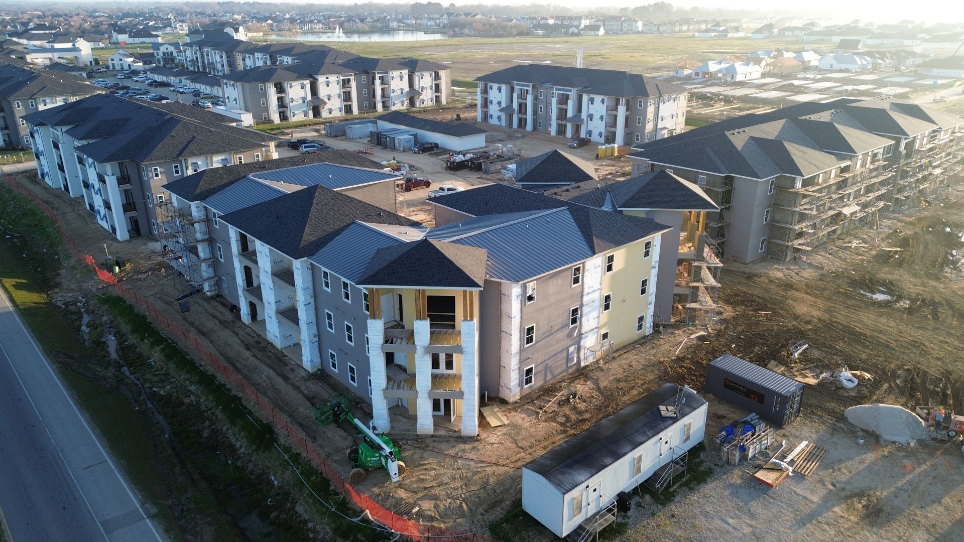 An aerial view of a large apartment building under construction.