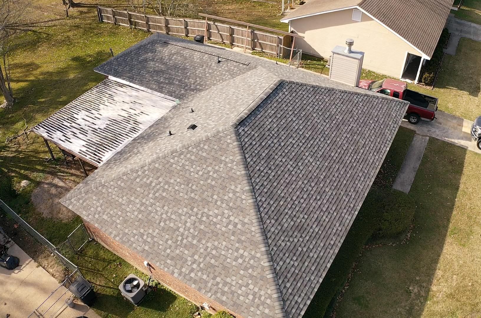 An aerial view of a house with a new roof