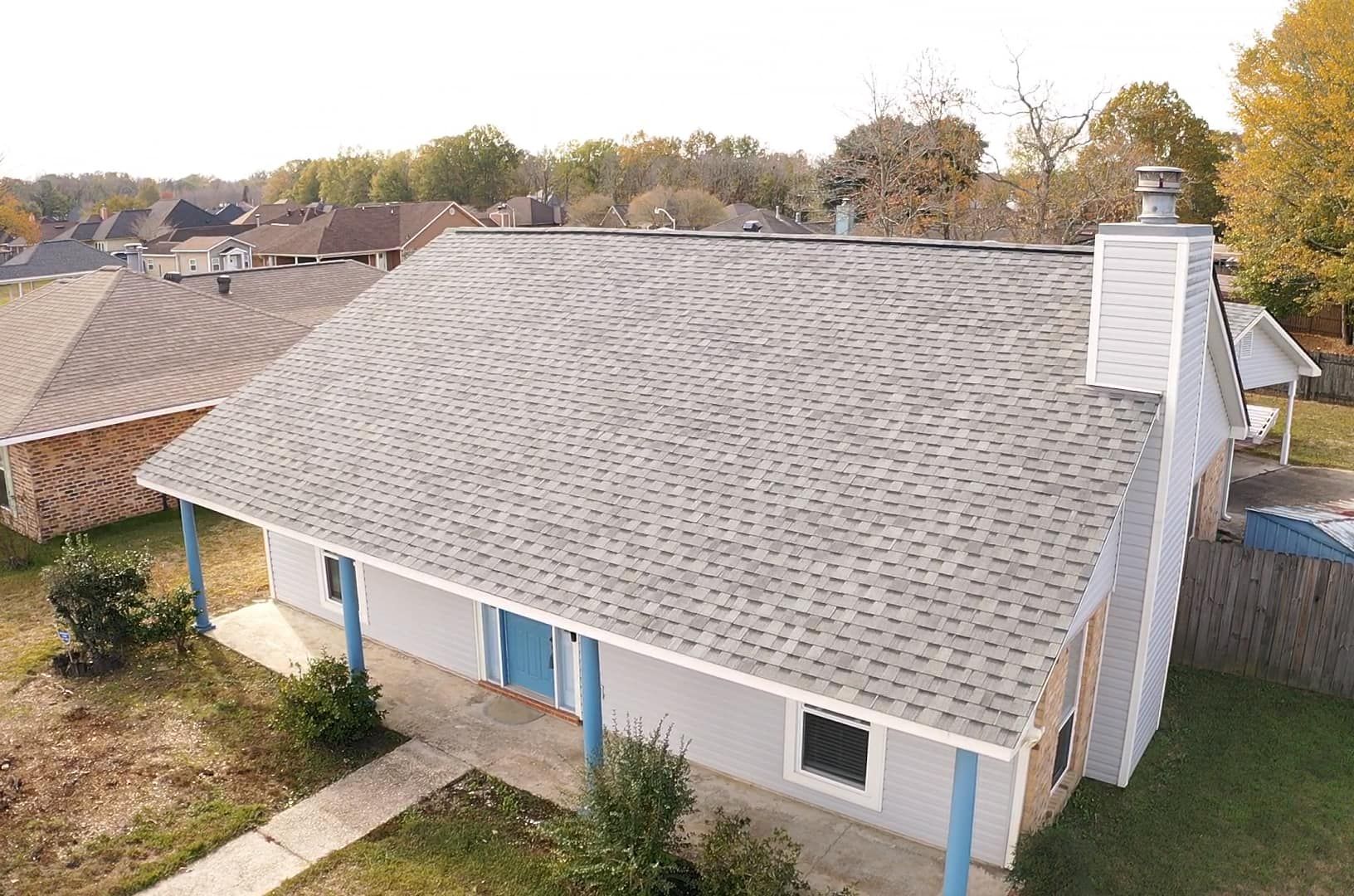 An aerial view of a house with a new roof