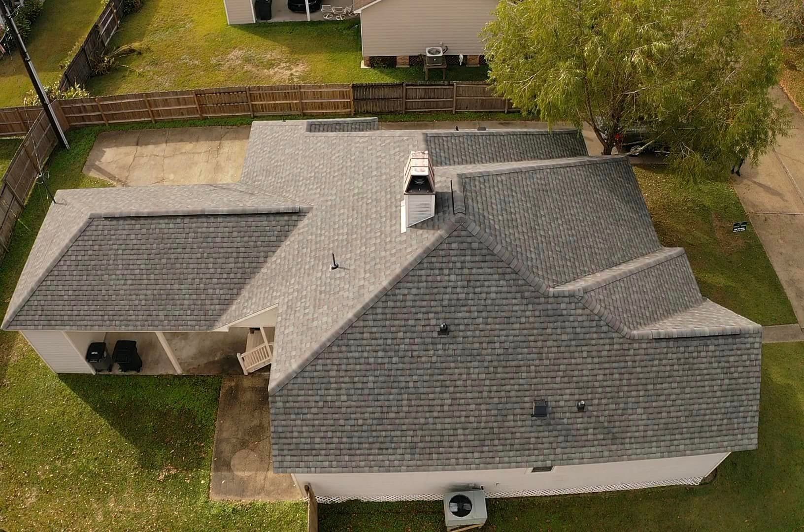 An aerial view of a house with a new roof
